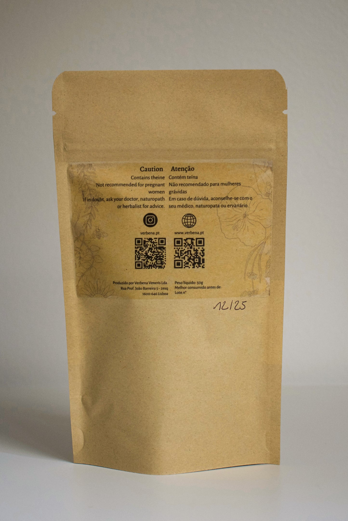 Kraft paper packaging of 'Midnight Sun' tea blend with visible ingredients on a plain background