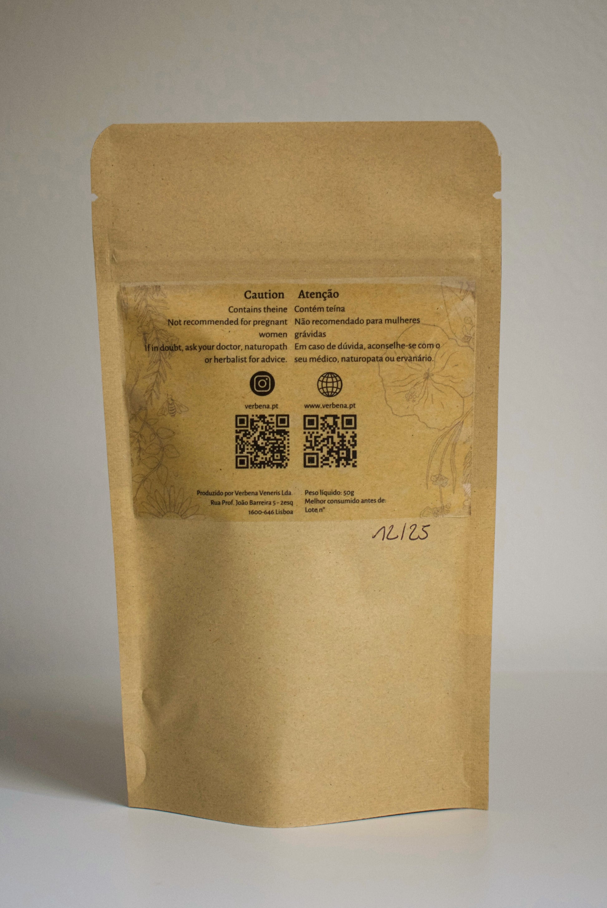 Kraft paper packaging of 'Midnight Sun' tea blend with visible ingredients on a plain background