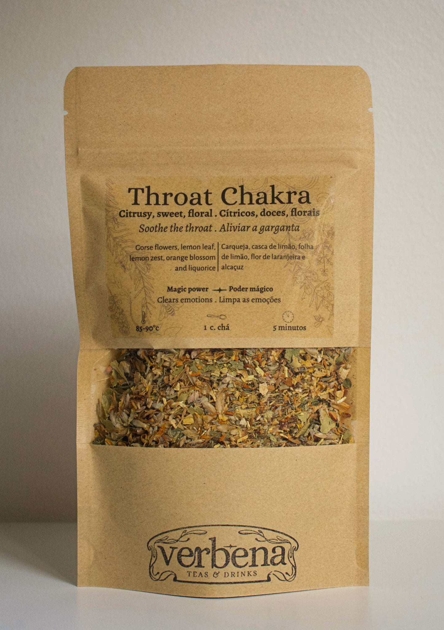 Brown paper package of 'Throat Chakra' tea from Verbena with throat chakra herbal blends inside.