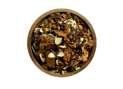 Wooden bowl with a herbal blend made of coconut, white tea, pineapple and dried peaches