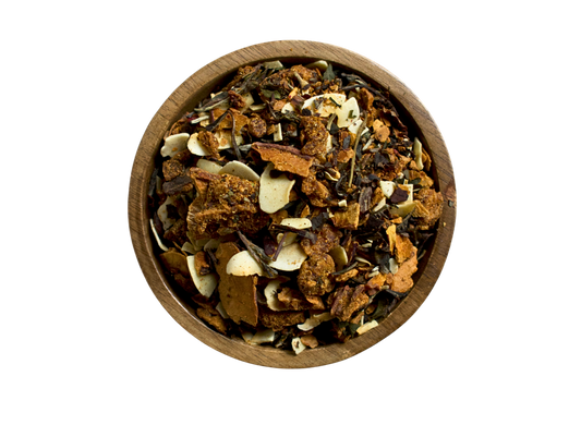 Wooden bowl with a herbal blend made of coconut, white tea, pineapple and dried peaches