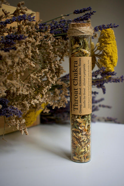 Glass tube with herbal blend Throat Chakra and label in kraft paper in the middle of the tube