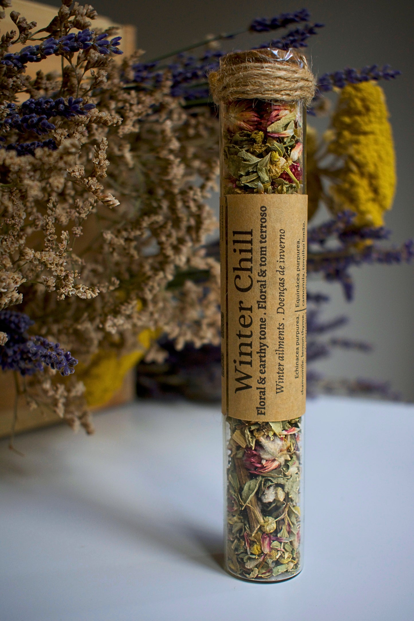 Glass tube with herbal blend Winter Chill and label in kraft paper in the middle of the tube
