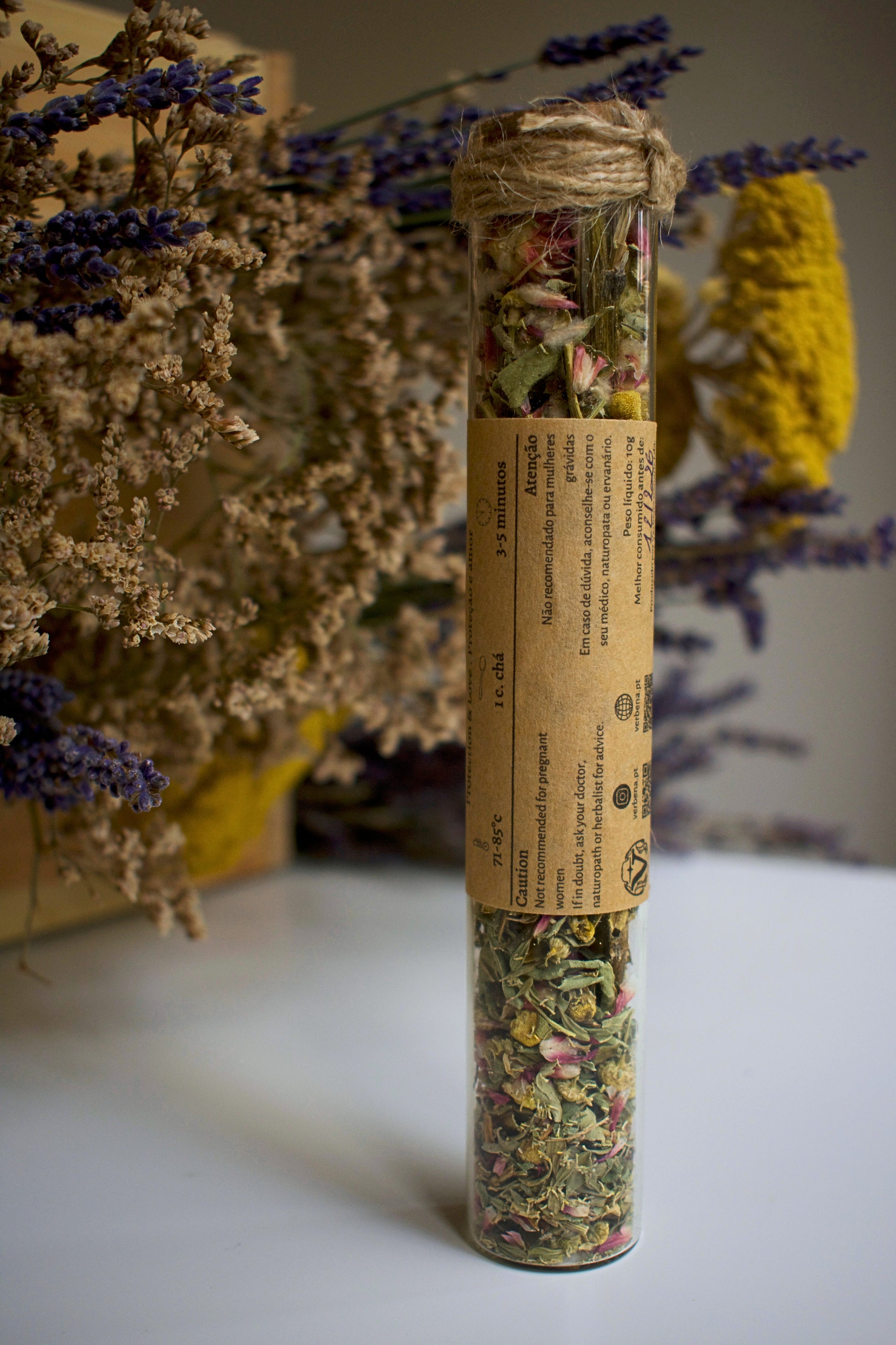 Glass tube with herbal blend Winter Chill and label in kraft paper in the middle of the tube