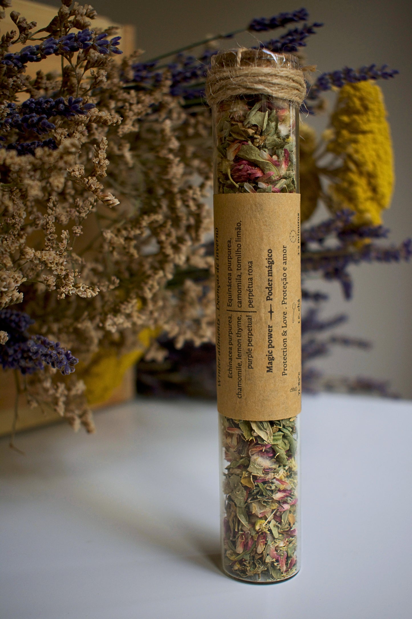 Glass tube with herbal blend Winter Chill and label in kraft paper in the middle of the tube